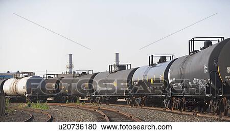 Row of oil tankers in train track View Large Photo Image Stock Image - Row of oil tankers in train track. Fotosearch