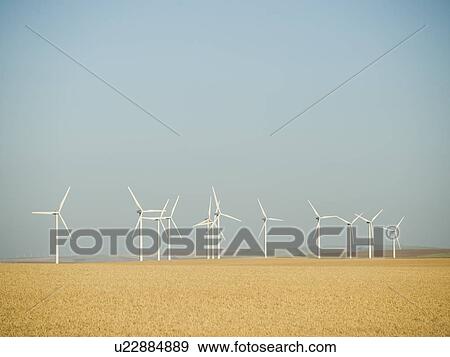 Row on windmills on wind farm View Large Photo Image Stock Photo - Row on windmills on wind farm. Fotosearch