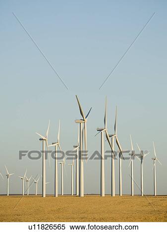 Rows of windmills on wind farm View Large Photo Image Stock Photography - Rows of windmills on wind farm. Fotosearch
