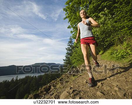 Runner on rocky trail View Large Photo Image Stock Image - Runner on rocky trail. Fotosearch