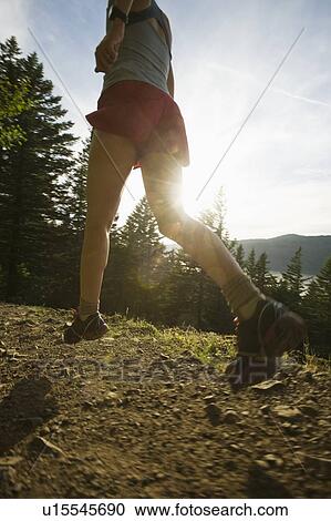 Runner on rocky trail View Large Photo Image Stock Image - Runner on rocky trail. Fotosearch