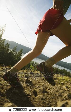 Runner on rocky trail View Large Photo Image Stock Image - Runner on rocky trail. Fotosearch