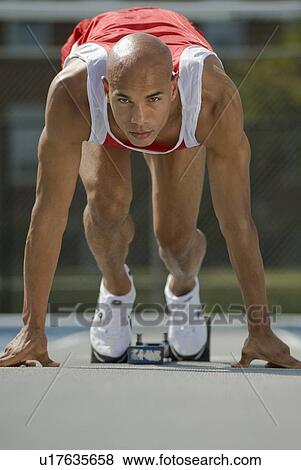 Runner on starter block View Large Photo Image Stock Photo - Runner on starter block. Fotosearch