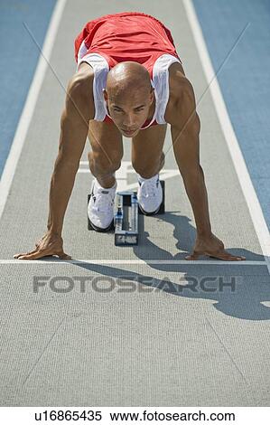 Stock Photography - Runner on starter block. Fotosearch