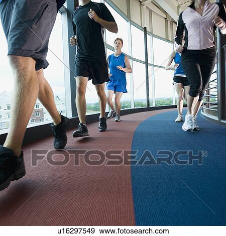 Runners on indoor track View Large Photo Image Stock Photo - Runners on indoor track. Fotosearch
