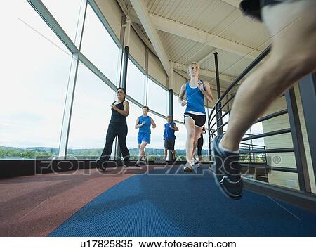Stock Photography - Runners on indoor track. Fotosearch
