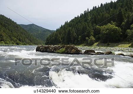 Stock Image - Scenic view of whitewater river. Fotosearch