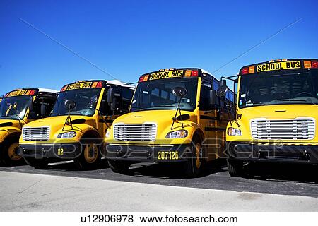 Stock Photo - school buses in a row. Fotosearch