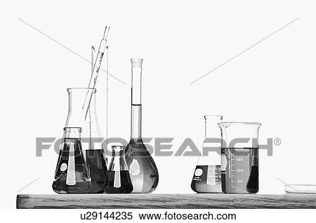 Science beakers with liquid on table View Large Photo Image Stock Photography - Science beakers with liquid on table. Fotosearch