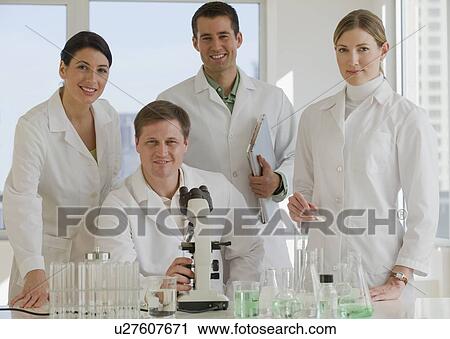 Scientists posing in pharmaceutical laboratory View Large Photo Image Stock Image - Scientists posing in pharmaceutical laboratory. Fotosearch