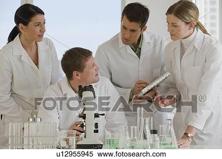 Stock Photography - Scientists working together in pharmaceutical laboratory. Fotosearch