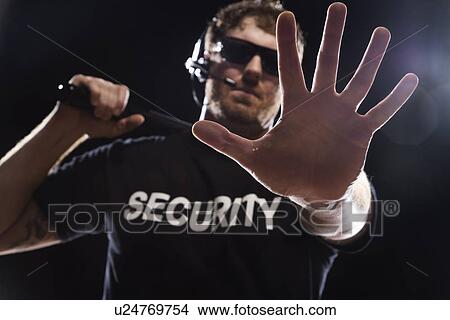 Security guard extending hand View Large Photo Image Picture - Security guard extending hand. Fotosearch
