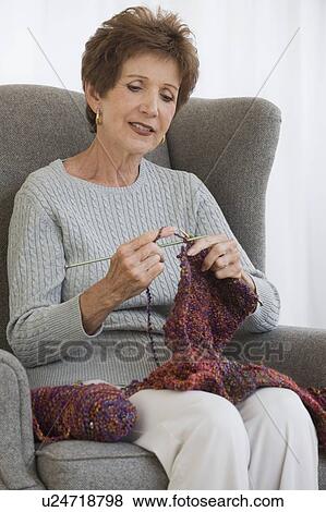 Stock Photo - Senior woman knitting. Fotosearch