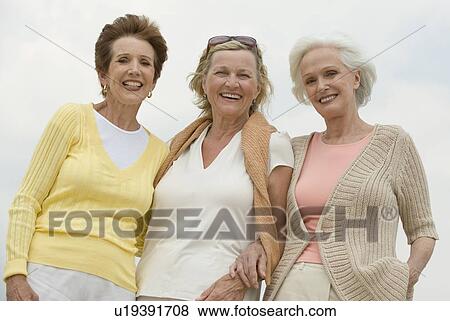Stock Photo - Senior women posing outdoors. Fotosearch
