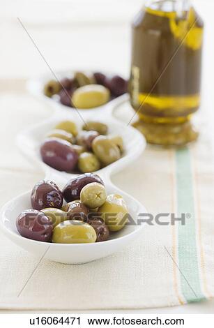 Stock Image - Serving bowl of assorted olives. Fotosearch