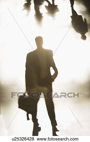 Stock Photo - Silhouette of businessman holding briefcase. Fotosearch
