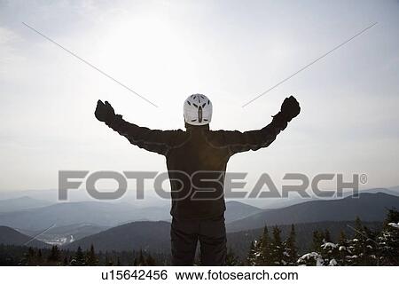 Snowboarder at top of ski hill View Large Photo Image Stock Photograph - Snowboarder at top of ski hill. Fotosearch