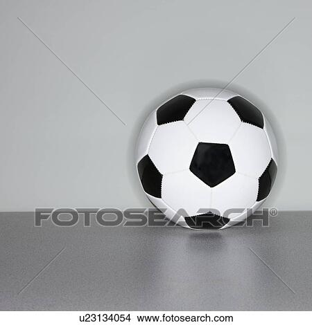 Soccer ball next to wall View Large Photo Image Picture - Soccer ball next to wall. Fotosearch