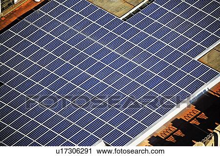 Stock Image - solor panels on skyscraper. Fotosearch