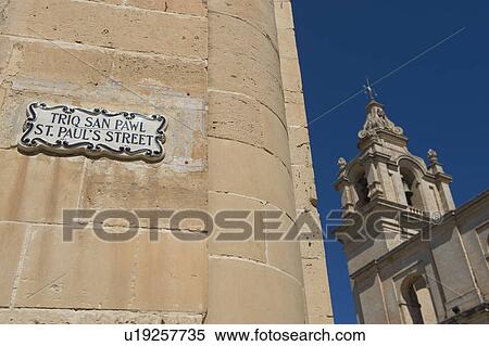 Stock Photography - St. Paul’s Street sign and Mdina Cathedral, Malta. Fotosearch