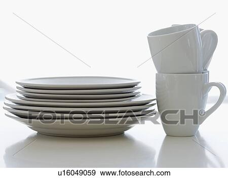 Stacks of plates and cups View Large Photo Image Stock Photo - Stacks of plates and cups. Fotosearch