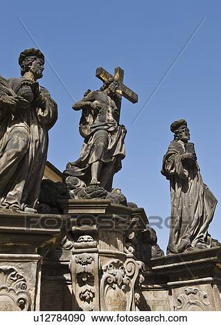 Stock Image - Statue of Saint Kosma, Saint Damian, and Christ in Prague. Fotosearch