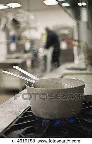 Steaming pots on gas stove View Large Photo Image Stock Photo - Steaming pots on gas stove. Fotosearch