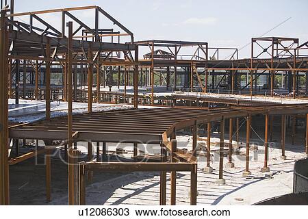 Steel beam frames at construction site View Large Photo Image Stock Image - Steel beam frames at construction site. Fotosearch