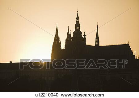 Sunset over silhouetted cathedral View Large Photo Image Stock Image - Sunset over silhouetted cathedral. Fotosearch