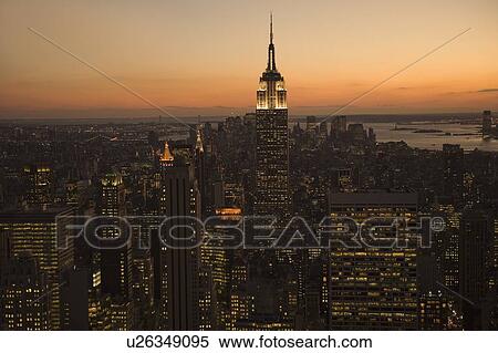 Stock Photography - Sunset view of Empire State Building and New York City. Fotosearch