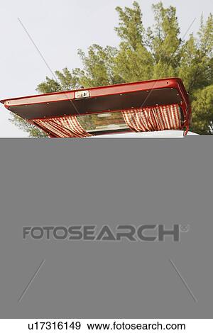 Teenage couple relaxing in van on beach View Large Photo Image Stock Photo - Teenage couple relaxing in van on beach. Fotosearch