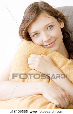 Teenage girl hugging pillow View Large Photo Image Stock Photography - Teenage girl hugging pillow. Fotosearch