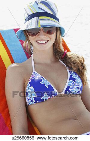 Teenage girl relaxing on beach View Large Photo Image Stock Photograph - Teenage girl relaxing on beach. Fotosearch