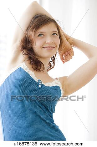 Stock Photograph - Teenage girl stretching. Fotosearch