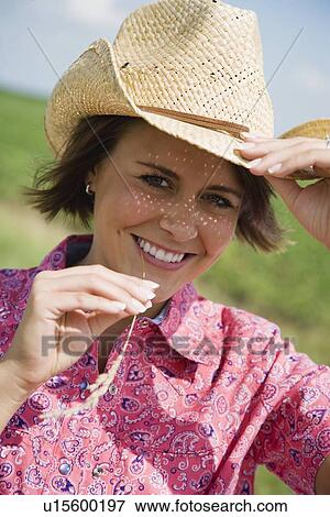 Stock Photo - Teenage girl wearing straw hat. Fotosearch