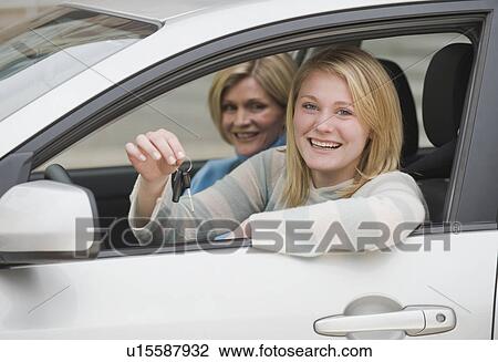 Teenaged girl in car with mother View Large Photo Image Stock Image - Teenaged girl in car with mother. Fotosearch