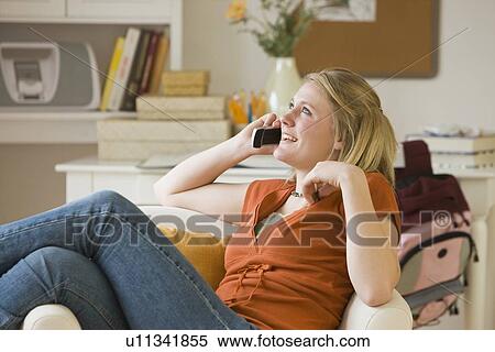 Teenaged girl talking on cell phone View Large Photo Image Stock Photography - Teenaged girl talking on cell phone. Fotosearch