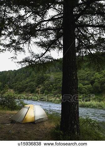 Tent and campsite by river View Large Photo Image Stock Photo - Tent and campsite by river. Fotosearch