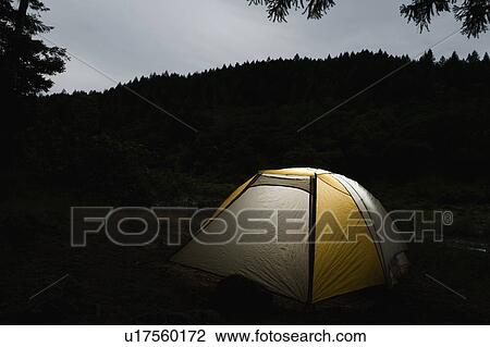 Tent illuminated at night View Large Photo Image Stock Image - Tent illuminated at night. Fotosearch