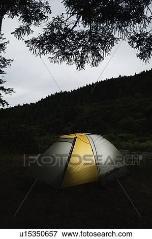 Tent illuminated at night View Large Photo Image Stock Photo - Tent illuminated at night. Fotosearch
