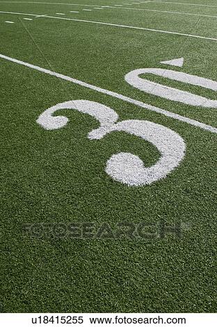 Stock Photography - Thirty yard line on football field. Fotosearch