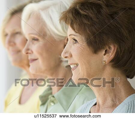 Three senior women standing in a row View Large Photo Image Stock Photo - Three senior women standing in a row. Fotosearch