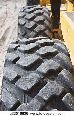 tires on heavy construction equipment View Large Photo Image Stock Photograph - tires on heavy construction equipment. Fotosearch