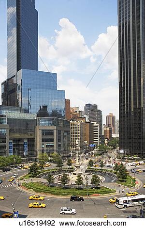 Traffic roundabout in busy urban setting View Large Photo Image Stock Image - Traffic roundabout in busy urban setting. Fotosearch