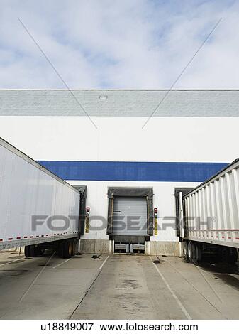 Trucks parked at loading dock View Large Photo Image Stock Photo - Trucks parked at loading dock. Fotosearch