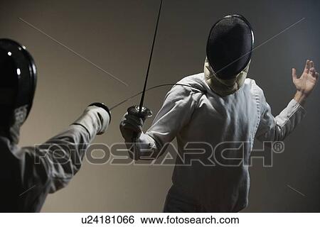 Stock Photograph - Two men fencing. Fotosearch