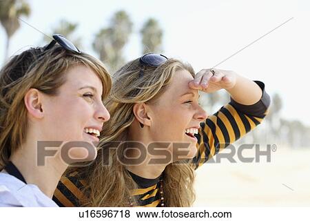 Two young women with sunglasses on head View Large Photo Image Stock Photo - Two young women with sunglasses on head. Fotosearch