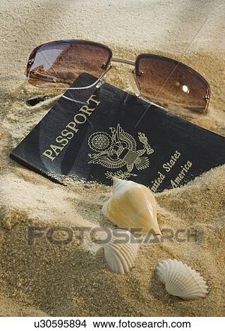 United States passport, sunglasses, and seashells View Large Photo Image Picture - United States passport, sunglasses, and seashells. Fotosearch