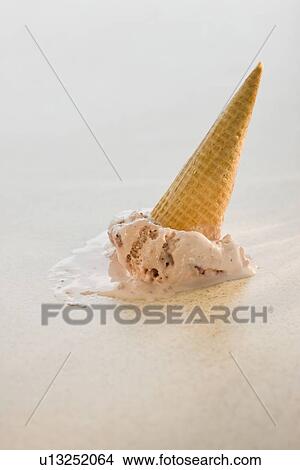 Picture - Upside-down ice cream cone. Fotosearch