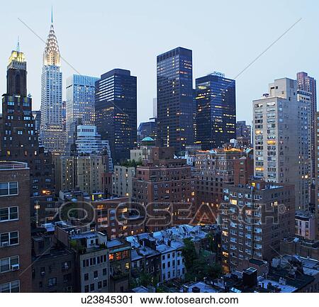 Stock Image - Urban buildings at night. Fotosearch